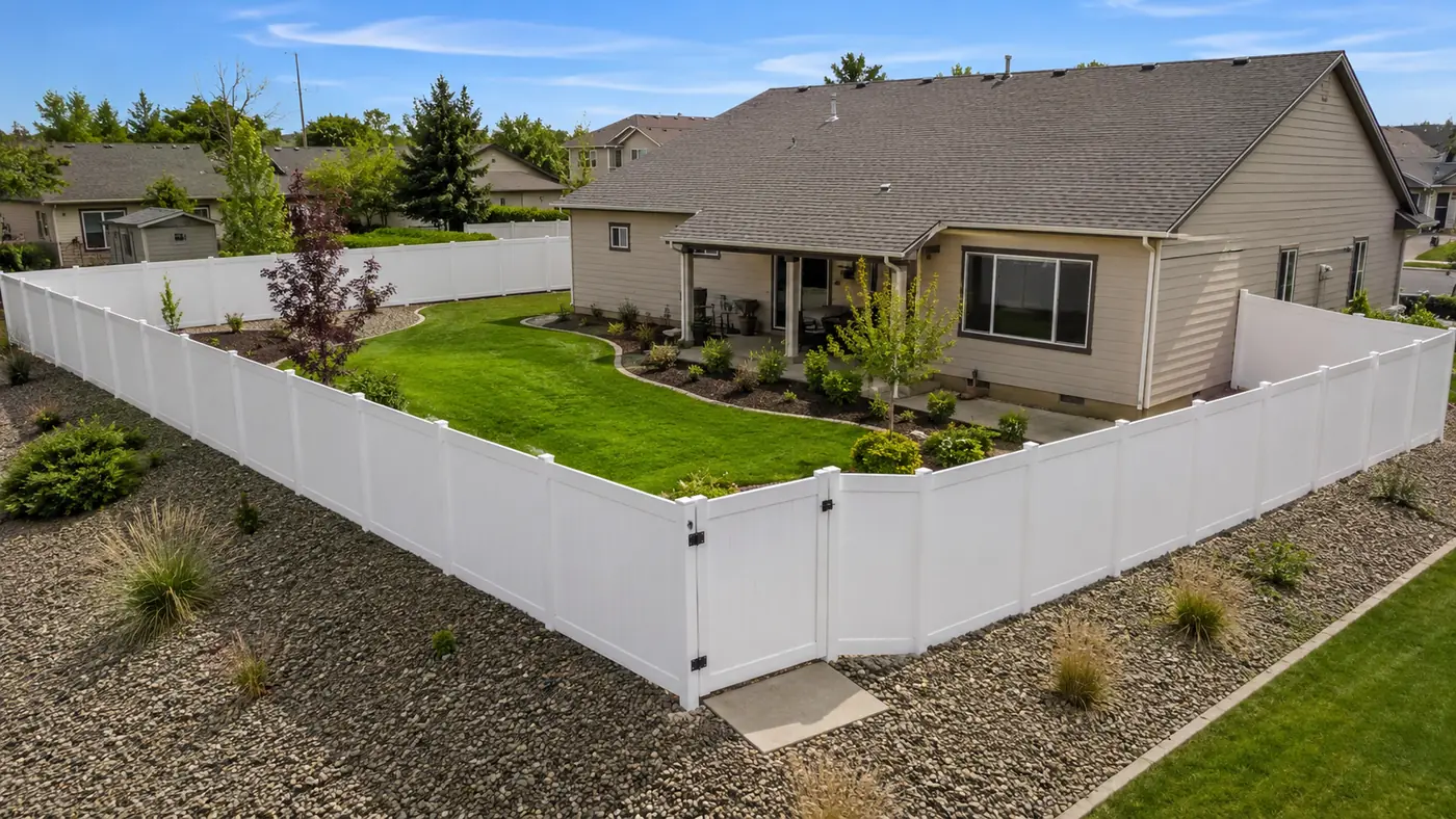 White vinyl fence around a corner lot in Salem, OR